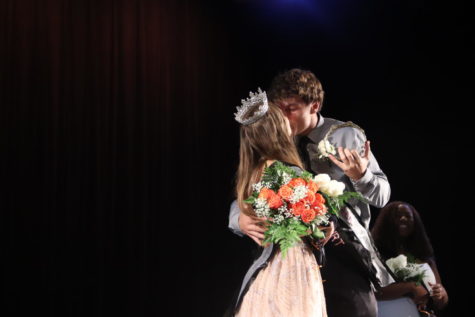 ROYALTY. Homecoming king Ryan Register pulls homecoming queen Sarah Darnley in for a kiss.