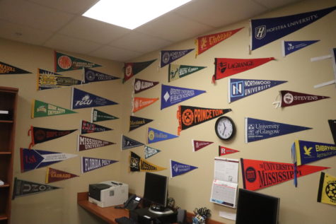 COLLEGE READY. The college room here at Oviedo High School. Students can visit
this location to discuss options for their future. On the walls, there are a plethora of
college flags on display to look at.