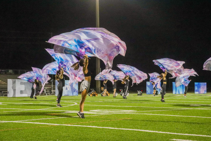 The Oviedo color guard practices for their performance.