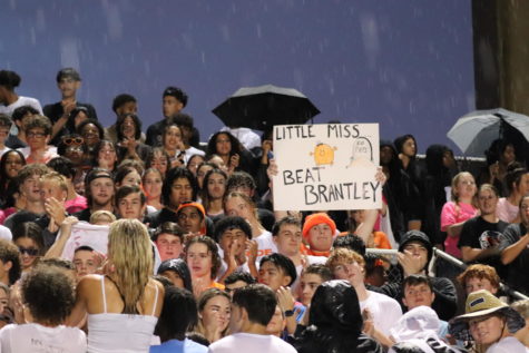 Oviedo students celebrate with school pride by showing up despite the rainy start. 