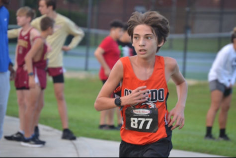 Aiden Aysun competes at the Hagerty Invitational 2022 cross country meet.