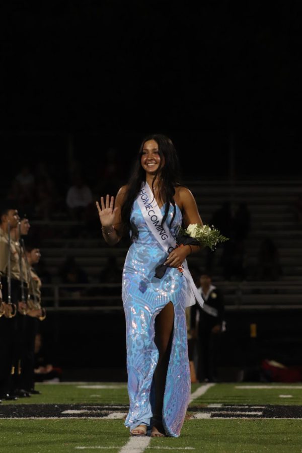 Senior Class President, Marin Rose, walks down during the homecoming court announcement.