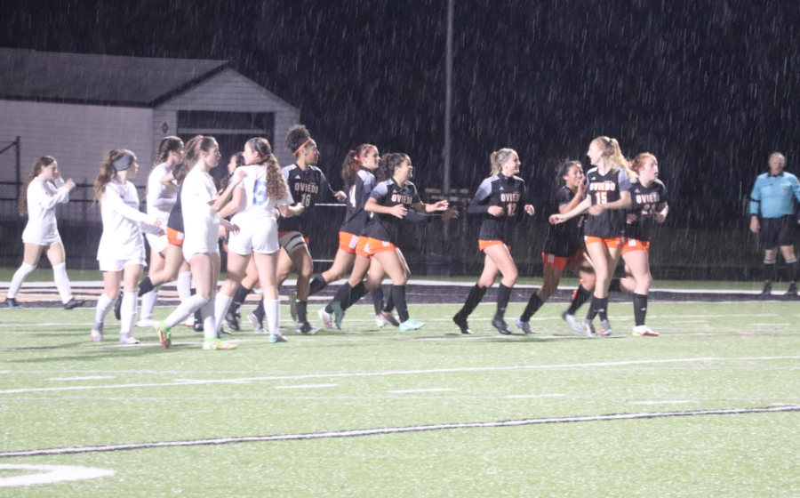 Players on the Oviedo girls soccer team celebrate after scoring a goal in the 2021 season regional game against Hagerty High School.