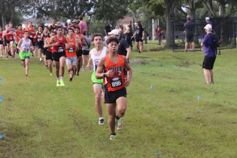 Yaniel Petrovich leads the pack at the Hagerty High School Cross Country Invitational.