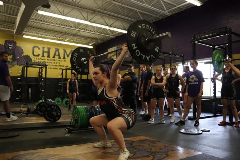 Lena Johnson prepares to push off during her clean and jerk attempt.