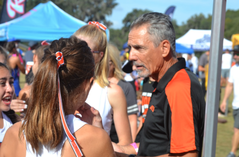 Coach Joe Hazera gives advice to runners before they run in the FHSAA Cross Country State Championship meet.