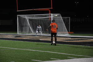 Senior soccer player Kosi Mafela dribbles towards the goal. Mafela signed to Wingate University Mens Soccer.