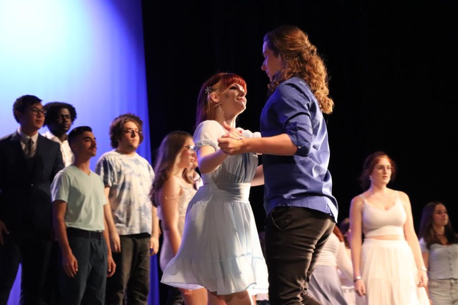 Singing her solo part in Let it Go, Victoria McGrogan and Kyle Cartee slow dance together
