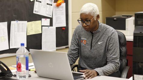 New Horizons Counselor. Keisha Jordan, works on her laptop before school.