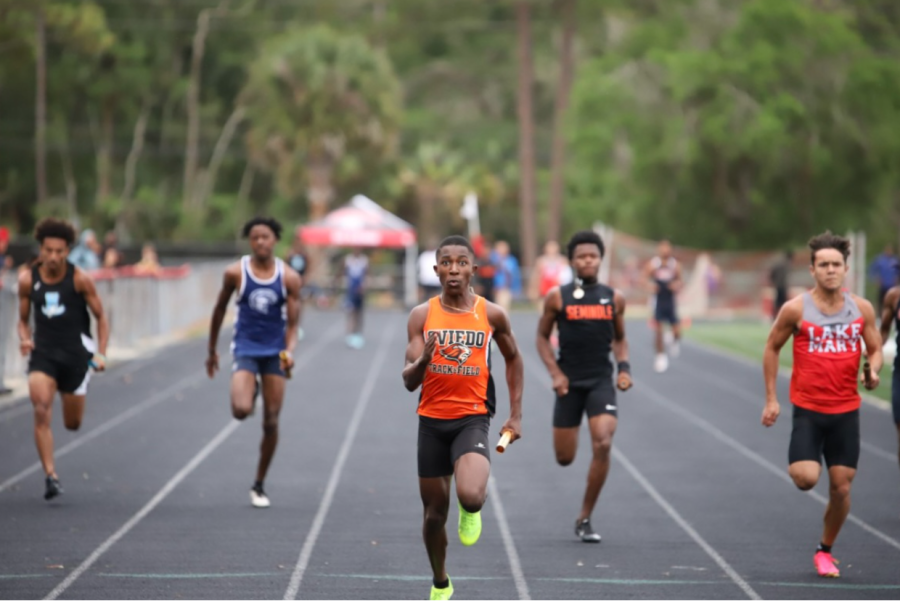 Sophomore Tristen Washington runs in the boys 4x100 meter relay race, contributing to the team’s qualification for the state meet.