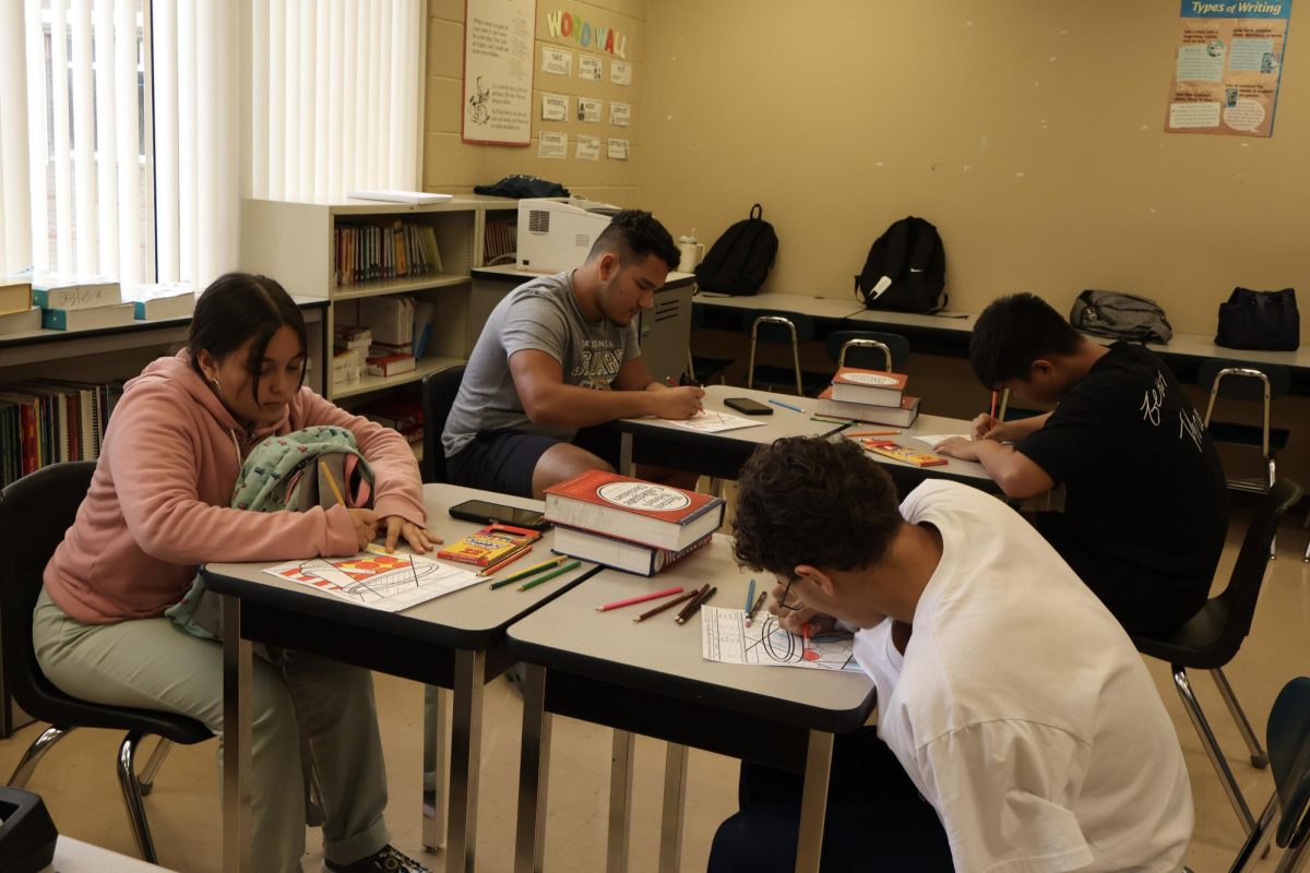 ESOL students focus and participate during their daily lecture. Class discussions, graphic organizers, and multimedia are all integral pieces used in their learning experience. Classmates are also able to connect through active English practice.