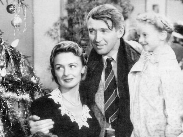 George, his wife Mary, and his daughter Zuzu celebrate Christmas as the townspeople gift him the missing money.