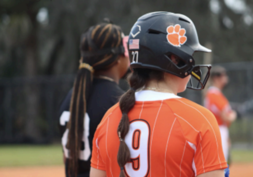 From lion to tiger: Varsity softball player Riley Fennell looks out onto the softball field. Fennell committed to Clemson University on November 8 to play NCAA Division I softball.