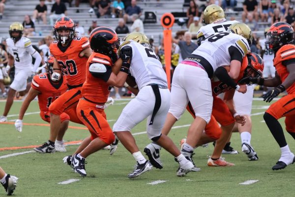 Defensive Captain Brady Manning fights off his block to secure a tackle.