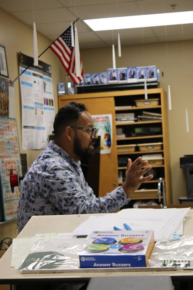 Mr. Jay teaches his 7th period Honors Physics class at the end of a long day.