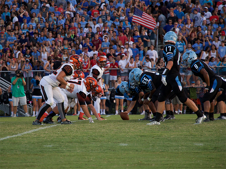 Oviedo defense gets set against Hagerty's offensive  line in 2016 game that ends with a loss for Oviedo and a score of 17-10. 