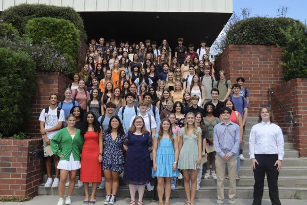  The newest members of the National Honor Society stand together on the stairs outside the auditorium. Amongst them are the returning members who organized the induction themselves.
