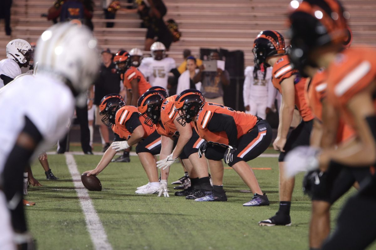 Wekiva High School's defense prepares to face Oviedo's offensive line.