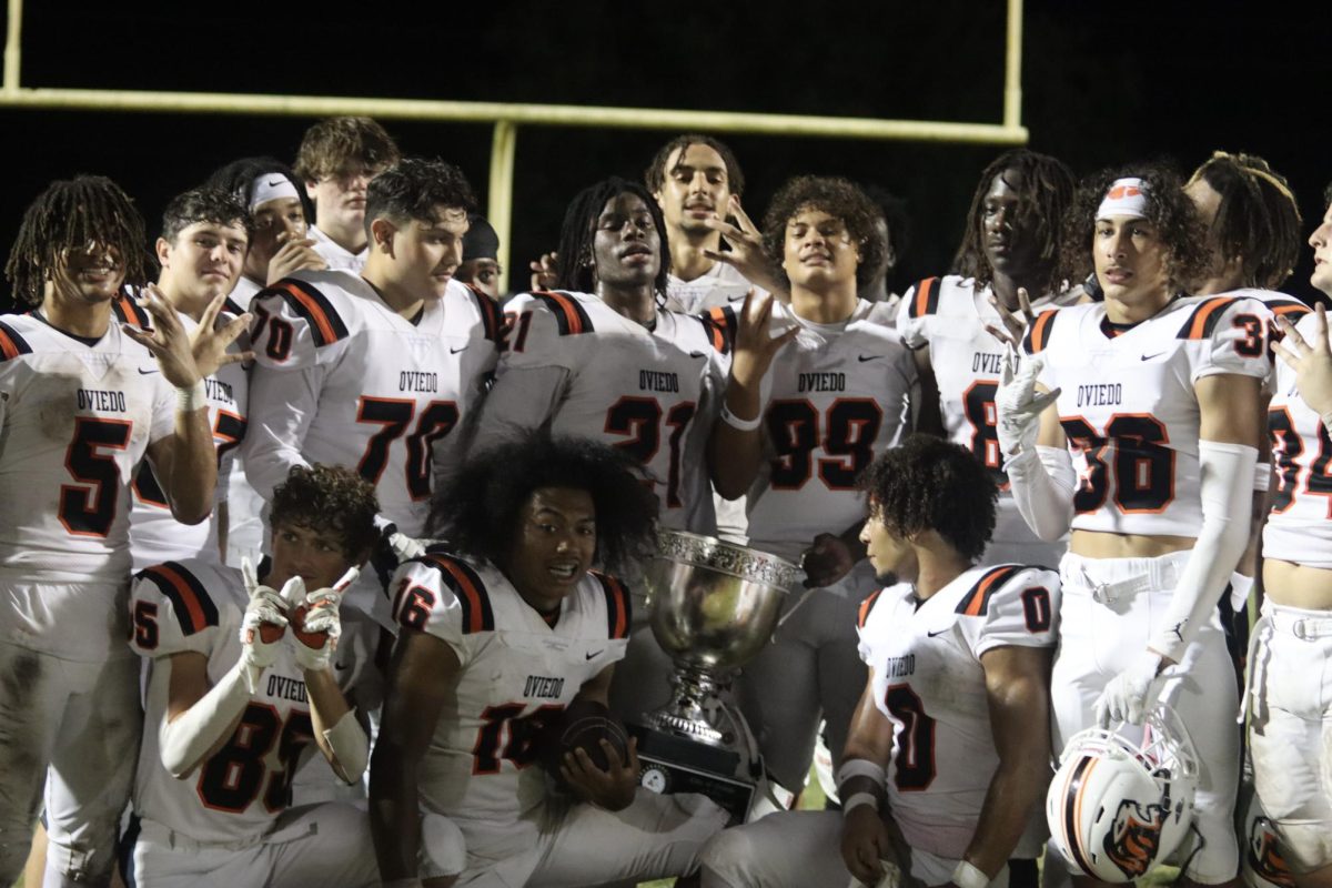 Oviedo's football team poses with the mayors cup, celebrating their 8th straight year achieving victory and the honor of the cup. 