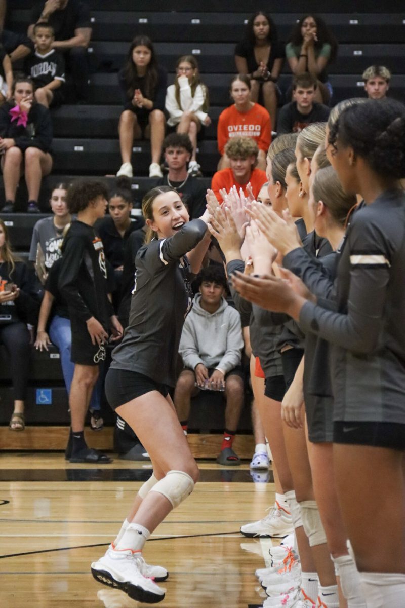  High fiving down the line of the Varsity non-seniors, Rylee Yarborough celebrates her Senior Night. “I had so much fun this season with my team,” Yarborough said. “I just felt all the love and support.” The Varsity team this year had four seniors from the class of 2025.