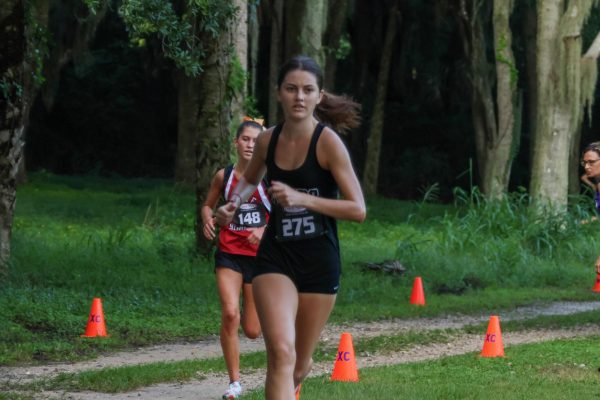 Senior Courtney Calhoun sprints to the finish. Calhoun is the top runner for Oviedo's girls varsity team. 