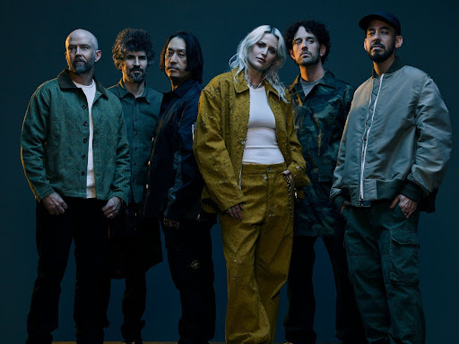 The current lineup for Linkin Park (from left to right) is Dave Farrell, Brad Delson, Joe Hahn, Emily Armstrong, Colin Brittain, and Mike Shinoda. After seven years of former lead singer Chester Bennington's death, the band attempts to reawaken its fame through new singer Emily Armstrong. Many fans are unsure whether to support her as a person, especially with the quality of the album.
Courtesy of James Minchin III by CC 4.0