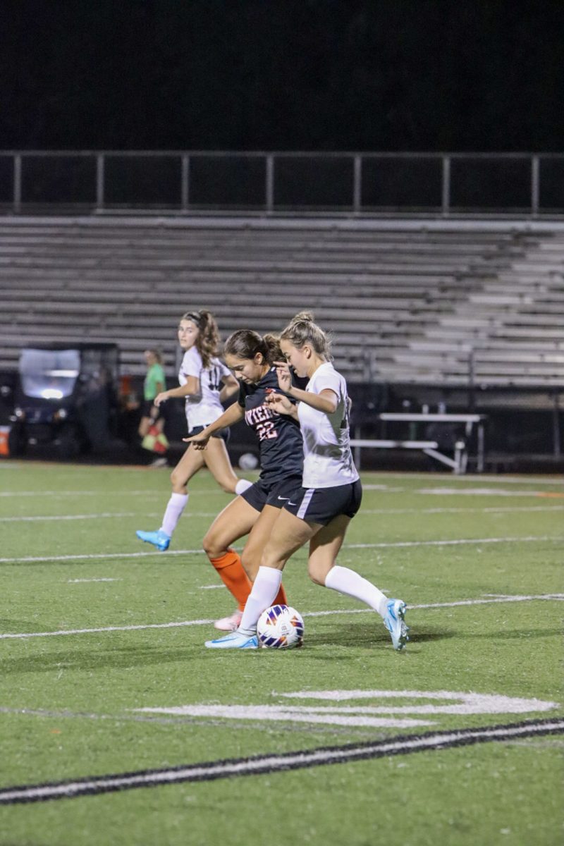 Laila Ayup wrestles the ball from Mailand opponent. 