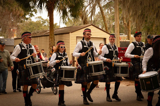 The pipers pipe and the drummers drum through the paths in the park in Winter Springs. This is one of the many sights to see at the yearly Central Florida Highland Games! There are shops, foods, games, creatures, and merriment more to see, too. 
