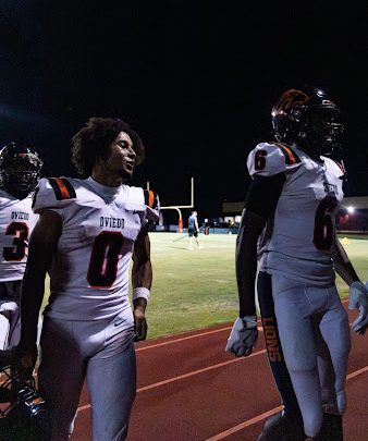 Wide Receivers Carmari Solomon(3), Emiliano Galarza(0), and Dashon Febres(6), walk off the field together. The trio combined for 125 yards and 5 touchdowns in the victory over Wekiva.