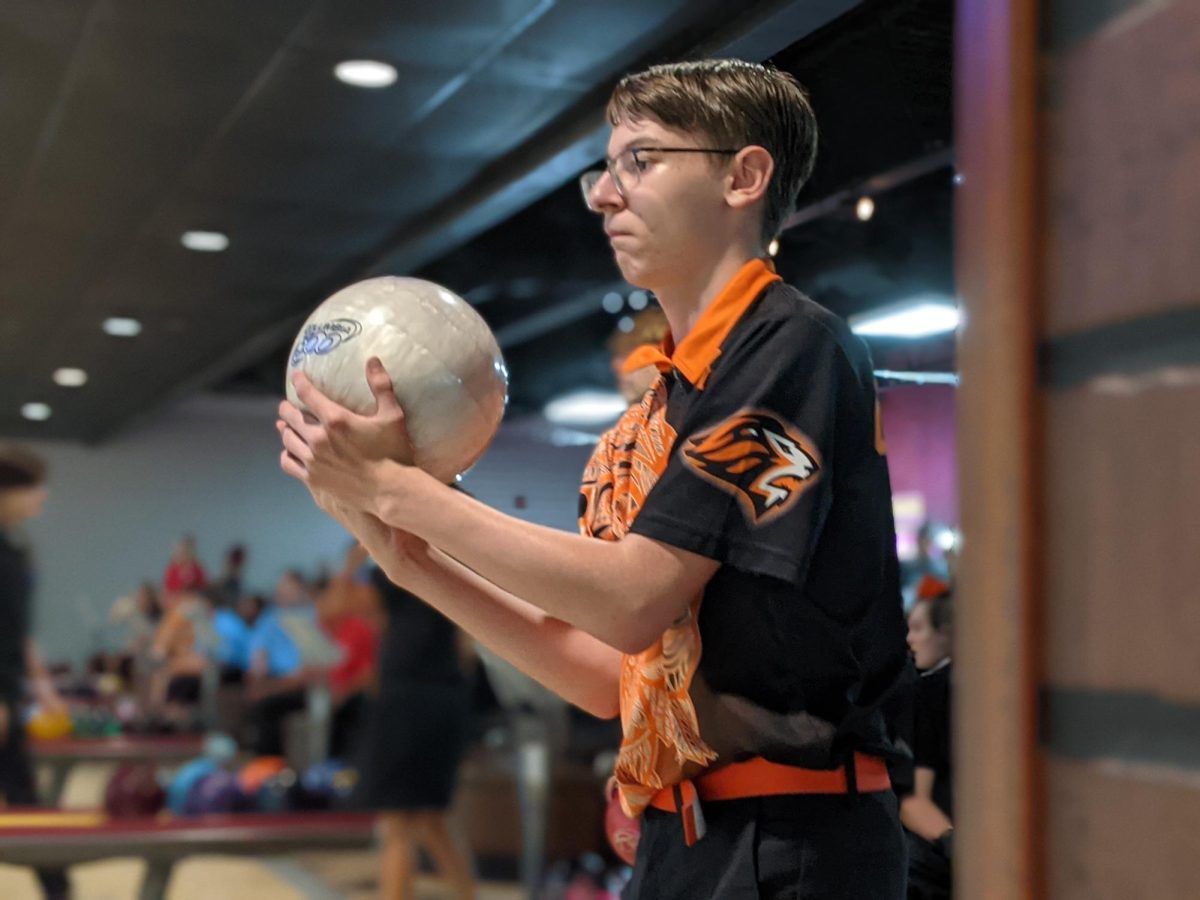 Senior Brendan Rauch bowls in an away match for the OHS team. In his fourth year on the team, Rauch has bowled for the past six years to work towards his goal. “I want to make it to states for bowling,” said Rauch.