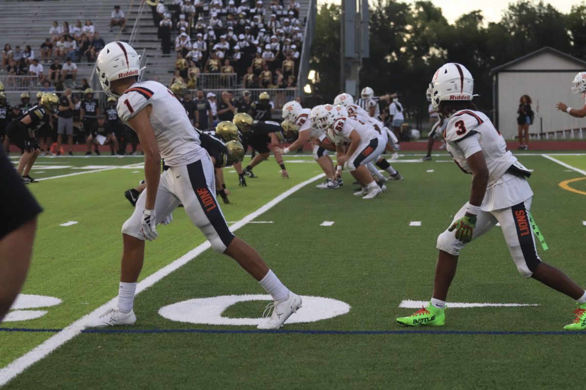 Junior wide receivers Jordan Donahoo and Carmari Solomon wait for the snap in last week's game against Bishop Moore.