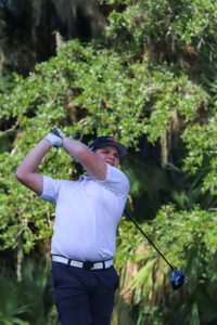 Caleb Anderson, senior, watching the ball in the air after a swing.