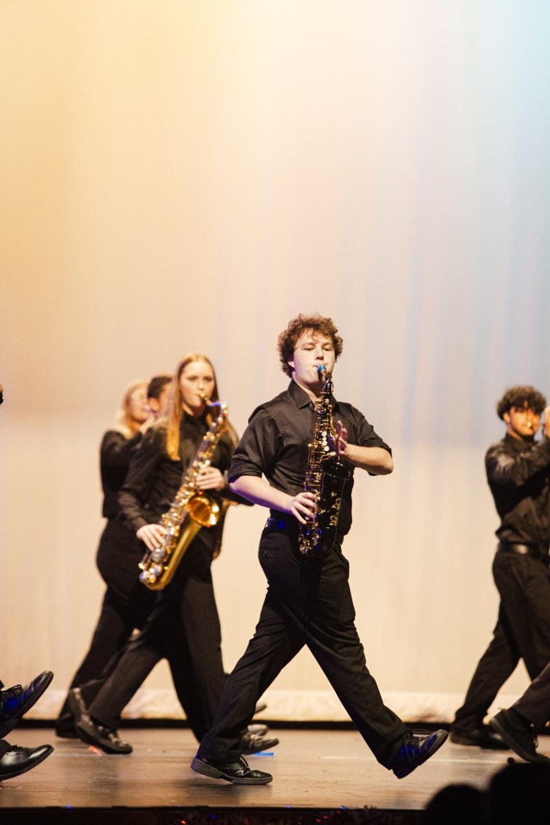 Junior Ian Stack-Thomas plays the saxophone in a performance of "Officer Krupke," originally from "West Side Story" and adapted by the musical "Blast!"