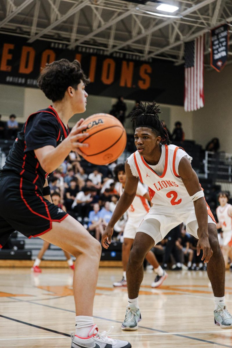 Junior point guard Carter Oden (2) playing defense against a player from Lake Mary High School on Dec. 2.