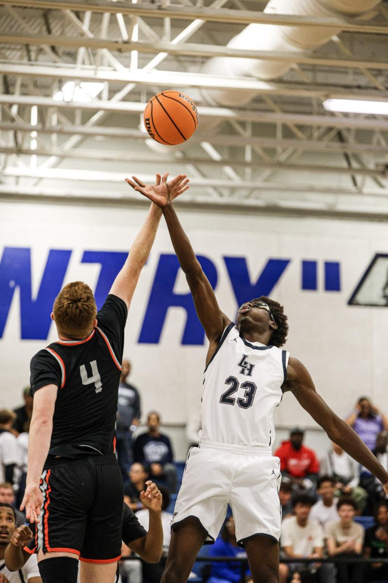Senior power forward Xander Bluhm (4) during tip-off against Lake Howell High School on Dec. 4.