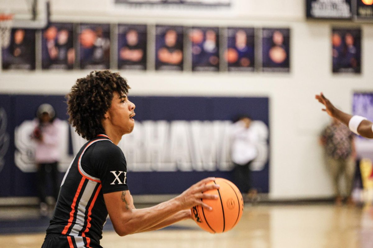 Senior Aidan Demeglio lines up a three in Oviedo’s 55-48 loss to Lake Howell. The team's point shooting has played a major role in their success, thanks to their 37 percent clip this year.