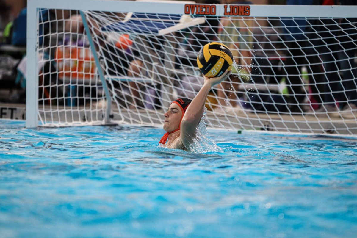 Sophomore goalie Charlie Warren makes a pass from the back in a 17-3 victory over Timber Creek. Warren’s goaltending has helped lead the Lions to an 8-2 record and the 12th ranking in Florida.