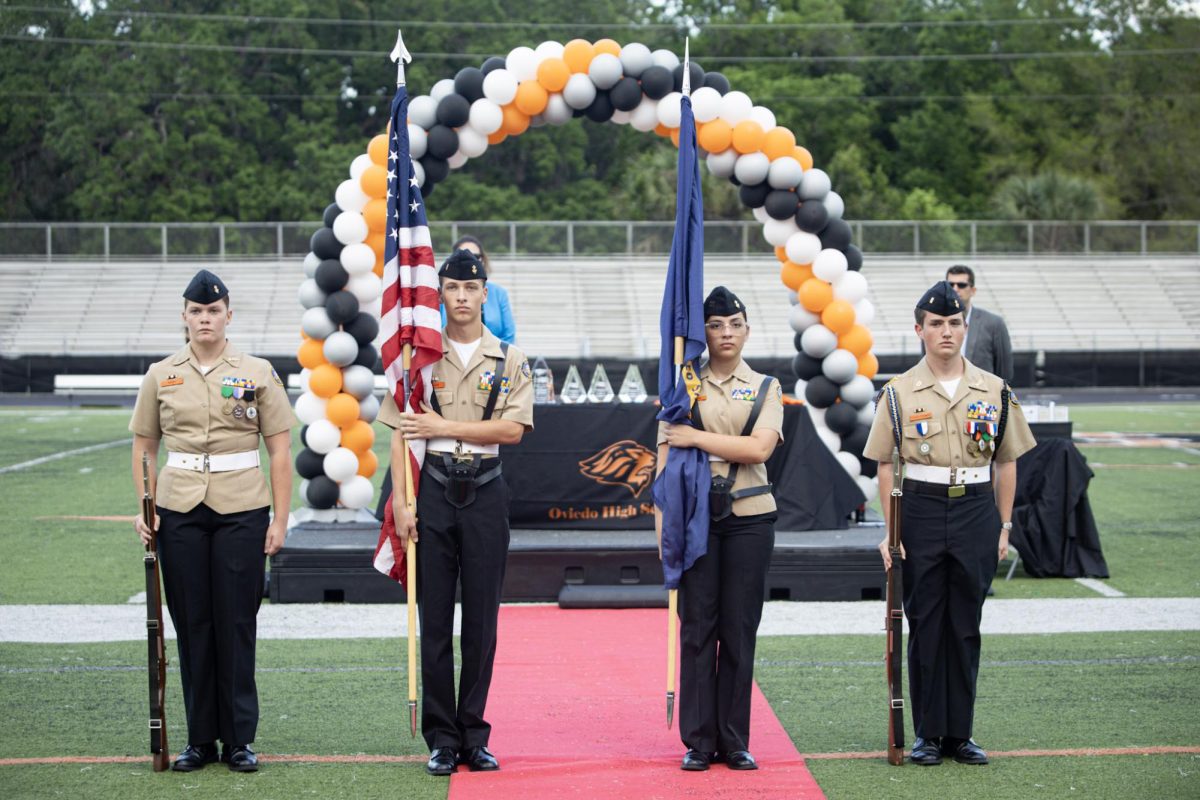 Members of the NJROTC Color Guard present colors at the beginning of the ceremony. Left to right: Eden Perry, Liam Cannon, Amanda De Jesus Negron, and Eric Stack-Thomas.