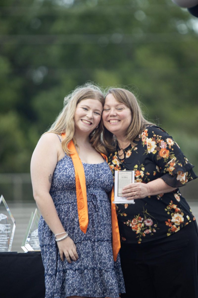 In a moment of joy, Zoe Walters hugs her sponsor, early childhood teacher Brittany Rogers.
